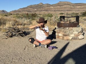 lisa cooper playing singing bowl in the desert